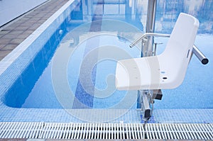 Swimming pool lift for disabled people access to the pool