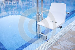 Swimming pool lift for disabled people access to the pool
