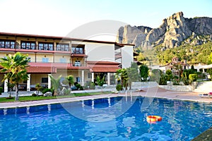 Swimming pool at the luxury hotel and Meteora mountains