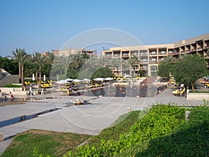 swimming pool at a luxury hotel, people having fun swimming in the pool in summer