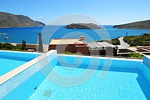 Swimming pool at luxury hotel with a view on Spinalonga Island