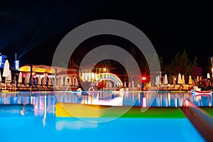Swimming pool at a luxury resort at night time
