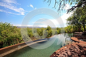Swimming pool in luxury safari lodge photo