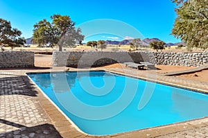 Swimming pool in luxury safari lodge camp, african savannah nature reserve, Namibia, South Africa