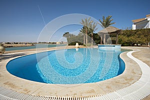 Swimming pool at at luxury tropical holiday villa resort