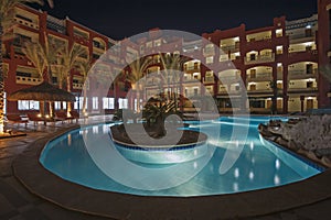 Swimming pool in luxury tropical hotel resort at night