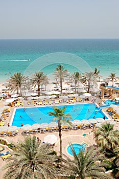 Swimming pool near beach at luxury hotel