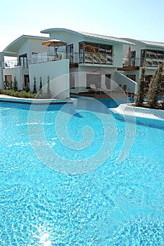 Swimming pool near villa at luxury hotel