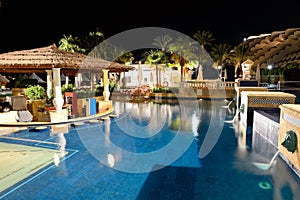 Swimming pool in night illumination at the luxury hotel