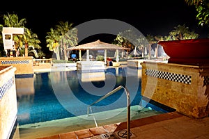 Swimming pool in night illumination at the luxury hotel