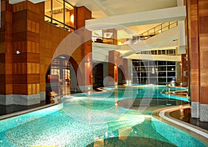Swimming pool at night in modern hotel