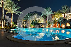 Swimming pool at night in one of the hotels near beach, Sharm El Sheikh, Egypt