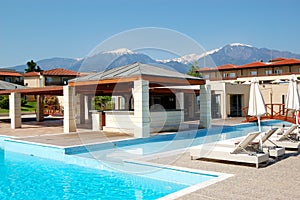 Swimming pool and outdoor restaurant at the modern luxury hotel