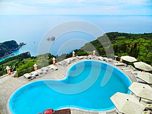 Swimming-pool over blue lagoon coast landscape ionian sea on Cor