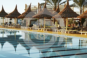 Swimming-pool and parasols