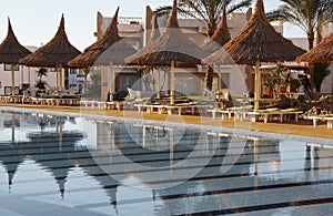 Swimming pool and parasols on resort