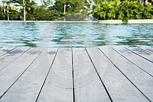 Swimming pool with poolside wooden deck