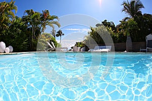 Swimming pool in a residential resort on a hot sunny day