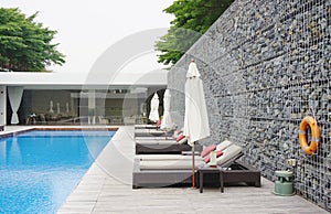 Swimming pool with rock wall photo