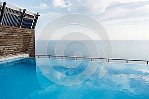 Swimming pool on the roof of the house overlooking the sea