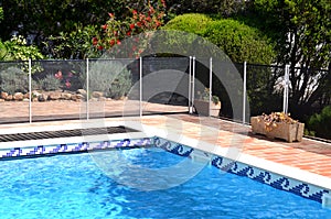 Swimming pool with safety fence