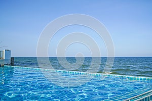 Swimming pool with sea background