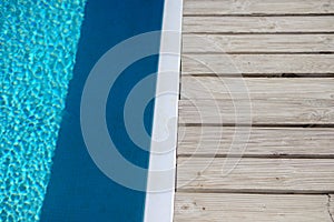 Swimming pool side with blue water background