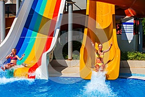 Swimming pool slides for children on water slide at aquapark.