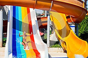 Swimming pool slides for children on water slide at aquapark.