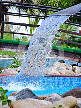 Swimming pool in spa with waterfall jet