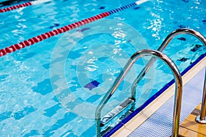 Swimming pool with stair ,selective focus.Metal staircase. Pool. Ladder. Release to the pool.activity relaxation.Place