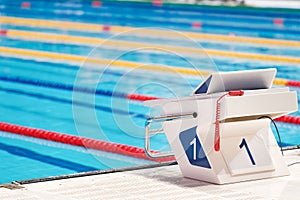 Swimming pool with starting block. Sport facility. Side view.