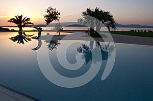 Swimming pool sunset photo