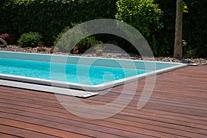 Swimming pool with teakwood flooring stripes summertime leisure ideas, teak wood decking