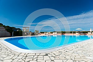 Swimming pool with tiled border and turquois water