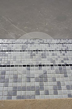 Swimming pool tiling