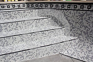Swimming pool tiling