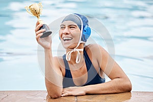 Swimming pool, trophy and a winner sports woman in water, feeling proud after a competitive race. Gold, award or
