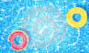 Swimming pool with two floating rings, caustic ripple and sunlight glare effect. Aquatic surface with waves background