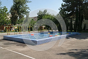 Swimming pool with water on the children`s playground in the kindergarten