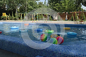 Swimming pool with water on the children`s playground in the kindergarten