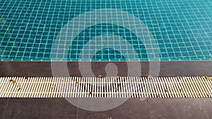 Swimming pool and Water drain at swimming pool`s edge