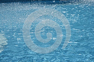 Swimming pool water sun reflection background. Ripple Water.