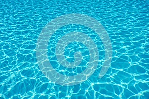 Swimming pool water sun reflection background. Ripple Water