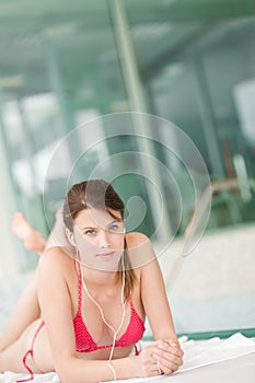 Swimming pool - woman relax listen to music