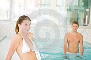 Swimming pool - young sportive couple relax