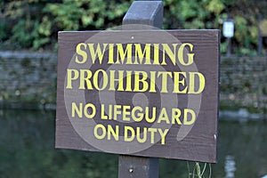 swimming prohibited no lifeguard on duty sign at swimming hole (waterfall in ithaca) safety, life guard, drowning, swim