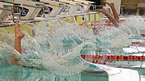 Swimming race start. Lots of splashing