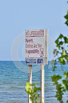 Swimming Safety Sign Posted Stating No Lifeguards Parents Children are Your Responsibility