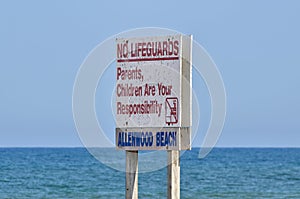 Swimming Safety Sign Posted Stating No Lifeguards Parents Children are Your Responsibility